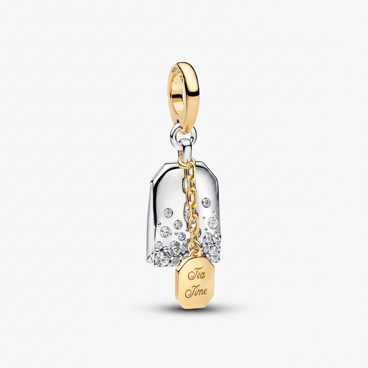 Tea Time Dangle Charm in 925 sterling silver and gold-tone with CZ crystals on white background