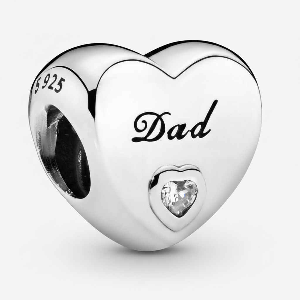 Close-up macro detail of Dad 925 sterling silver heart charm with engraved script and clear CZ stone
