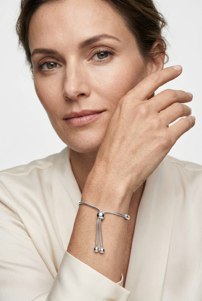 Model wearing the silver slider bracelet with her face visible